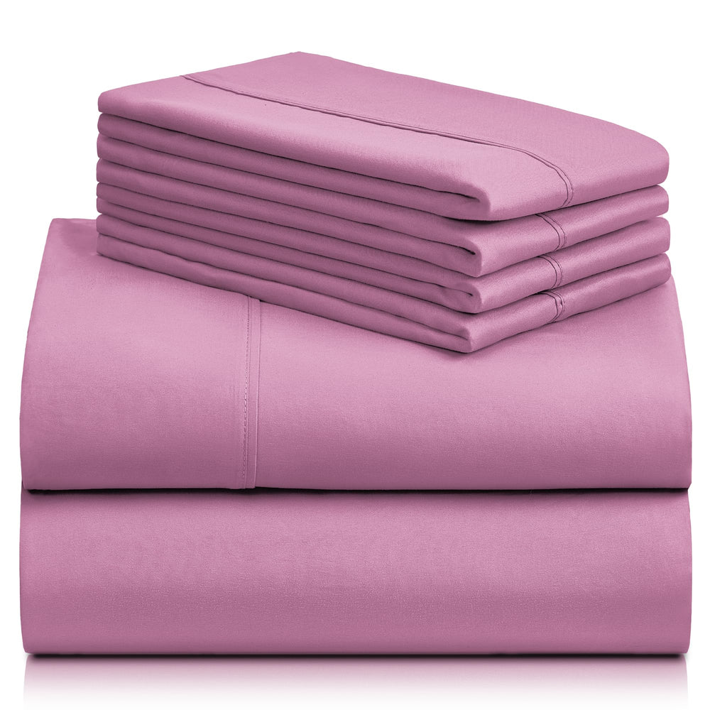 a stack of pink sheets