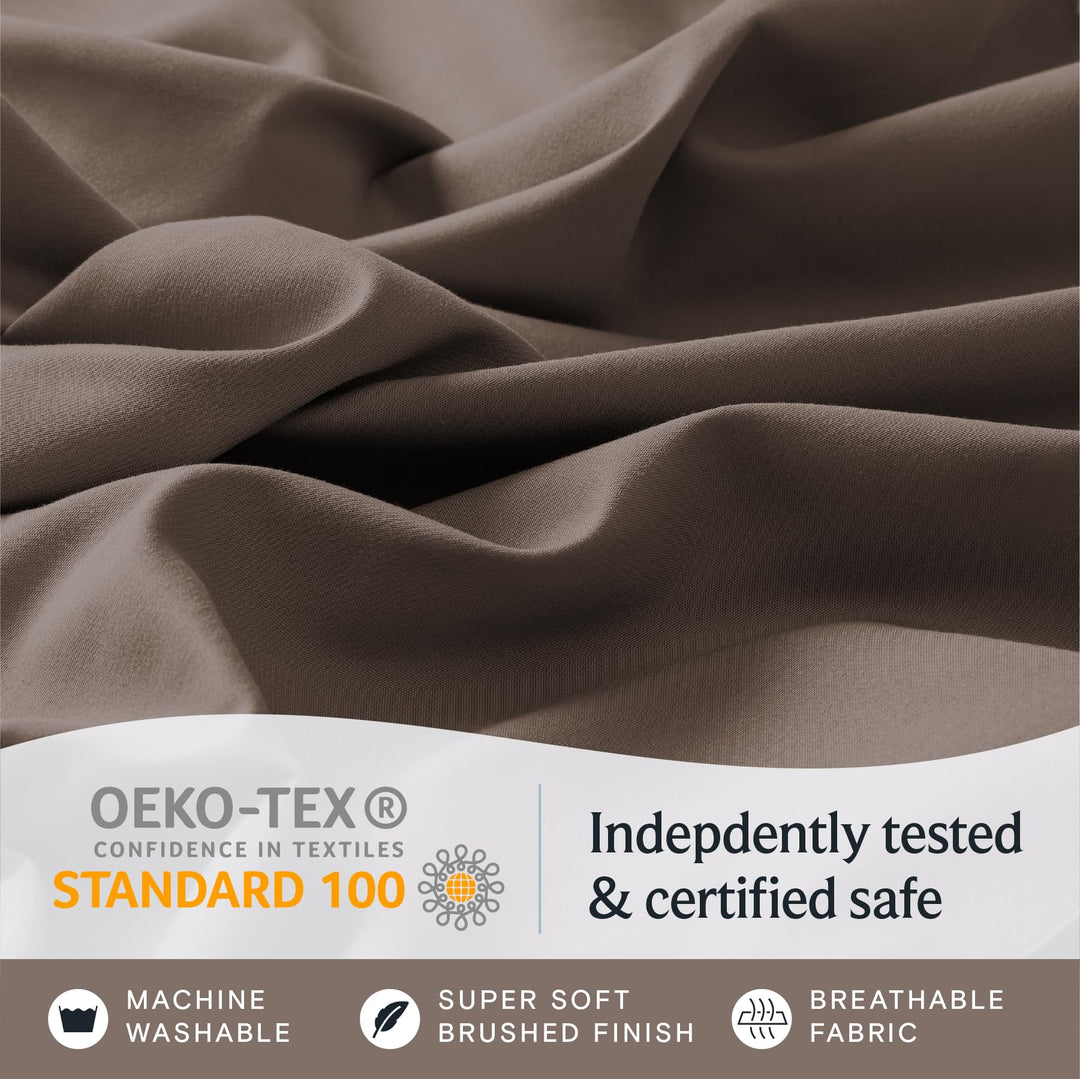 a close up of a fabric with text: 'OEKO-TEX Indepdently tested CONFIDENCE IN TEXTILES STANDARD 100 & certified safe MACHINE SUPER SOFT BREATHABLE WASHABLE BRUSHED FINISH FABRIC'